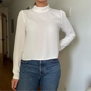 Aritzia White Babaton with mock neck collar.
